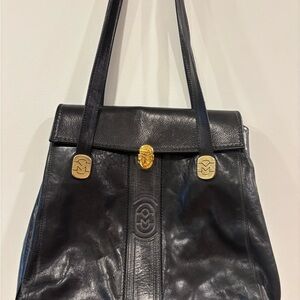 Black Shoulder Bag with Gold Clasps and Textured Design